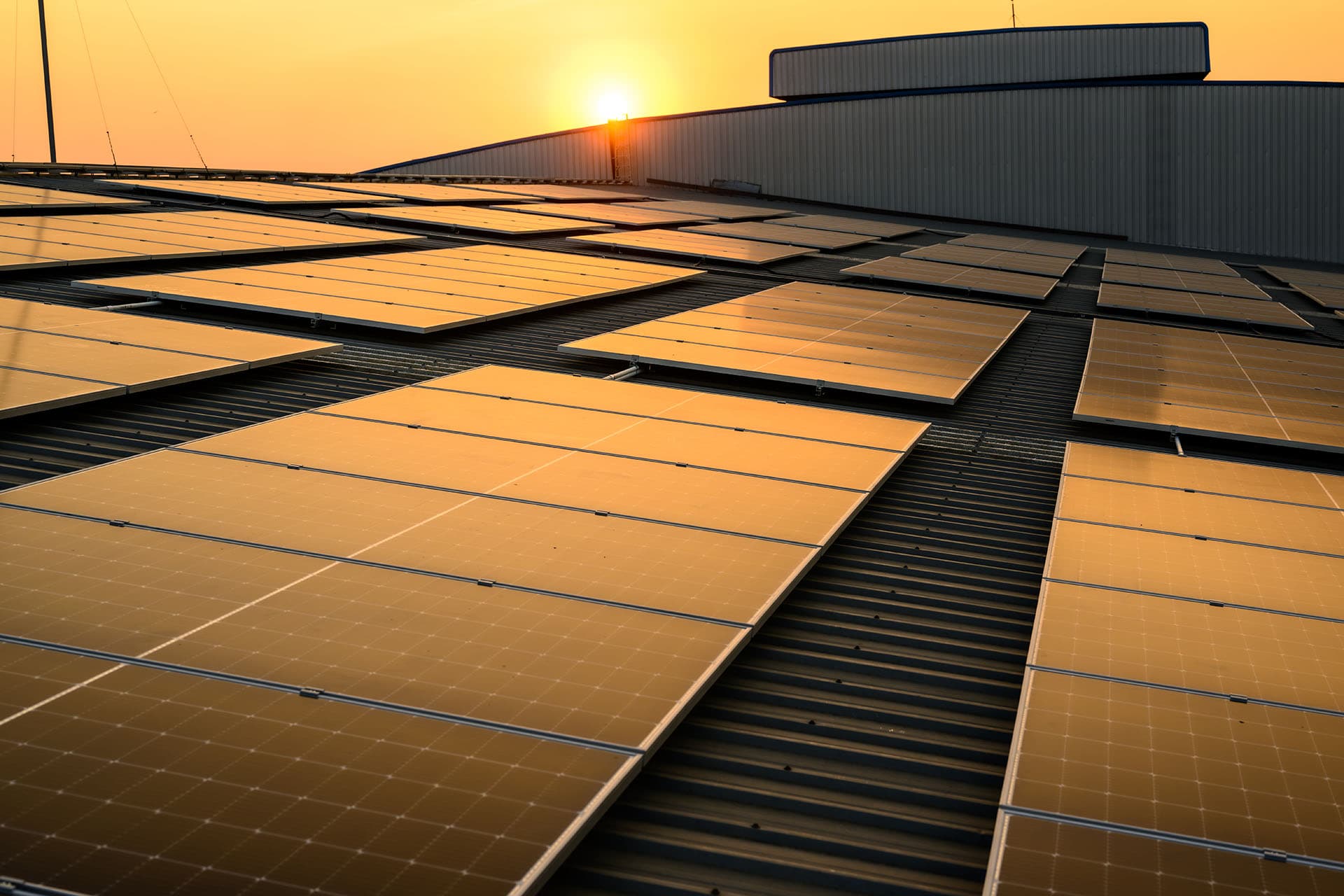 Solar panels on a roof under a clear sky